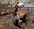Woman Jumping on Tough Mudder Obstacle Course