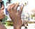 Man Drinking from R2D2 Water Bottle