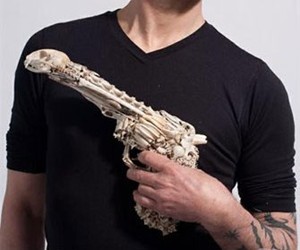 Man Holding Bone Pistol Man Holding Bone Pistol