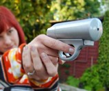 Woman Firing Mace Pepper Spray Gun