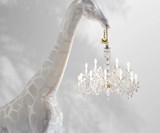 Life-Size Baby Giraffe Holding a Chandelier Light