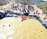 Man Flipping on Tough Mudder Obstacle Course