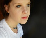 Girl Wearing Resident Evil T Virus Necklace