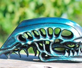 Wooden Alien Skull Phone Stand