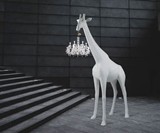 Life-Size Baby Giraffe Holding a Chandelier Light