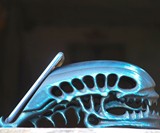 Wooden Alien Skull Phone Stand