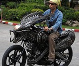 Man Riding Alien Motorcycle