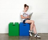 Girl Sitting on LEGO Recycling Bins